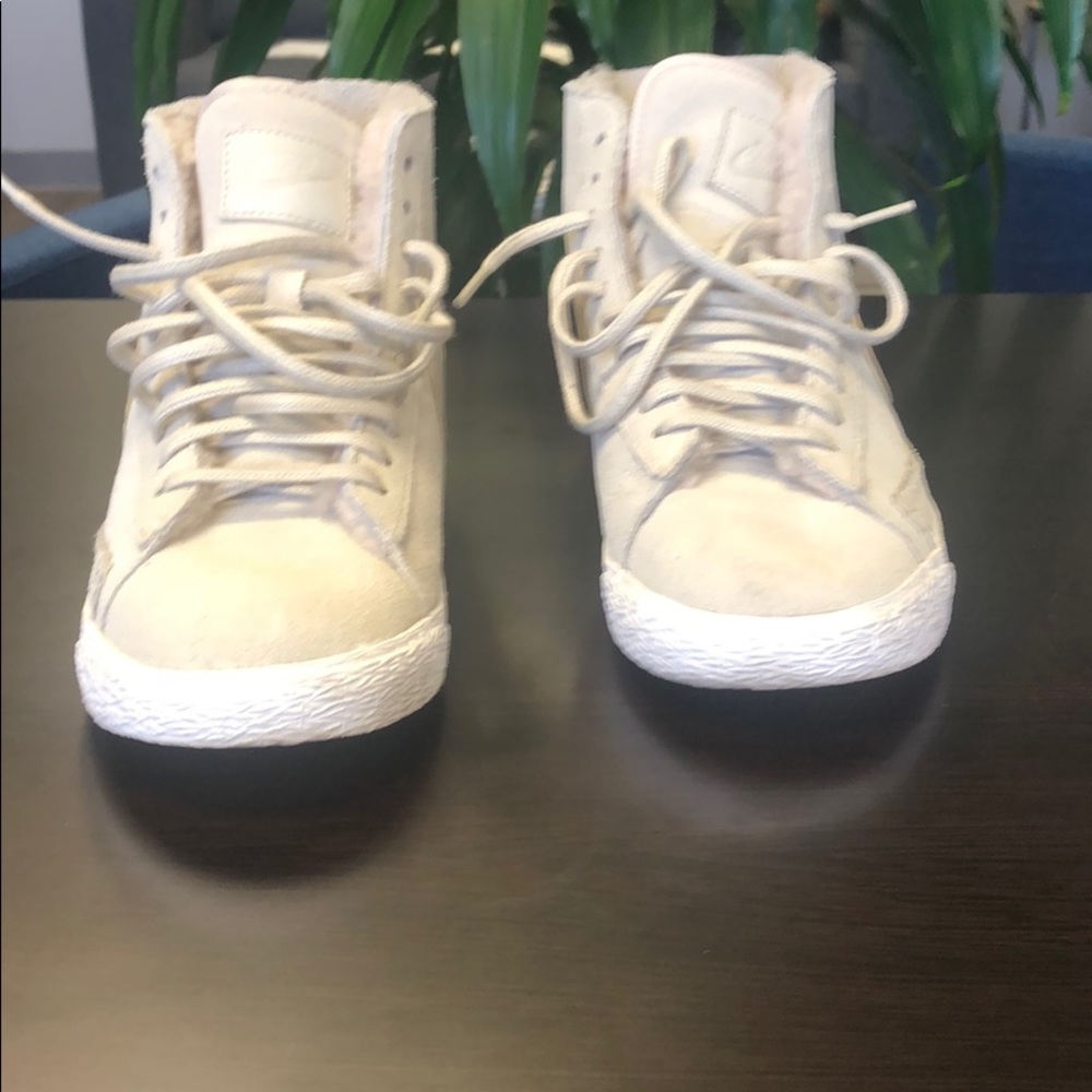 Nike high top sneakers.